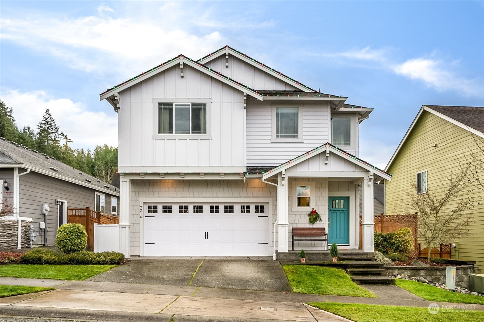 a front view of a house with a yard