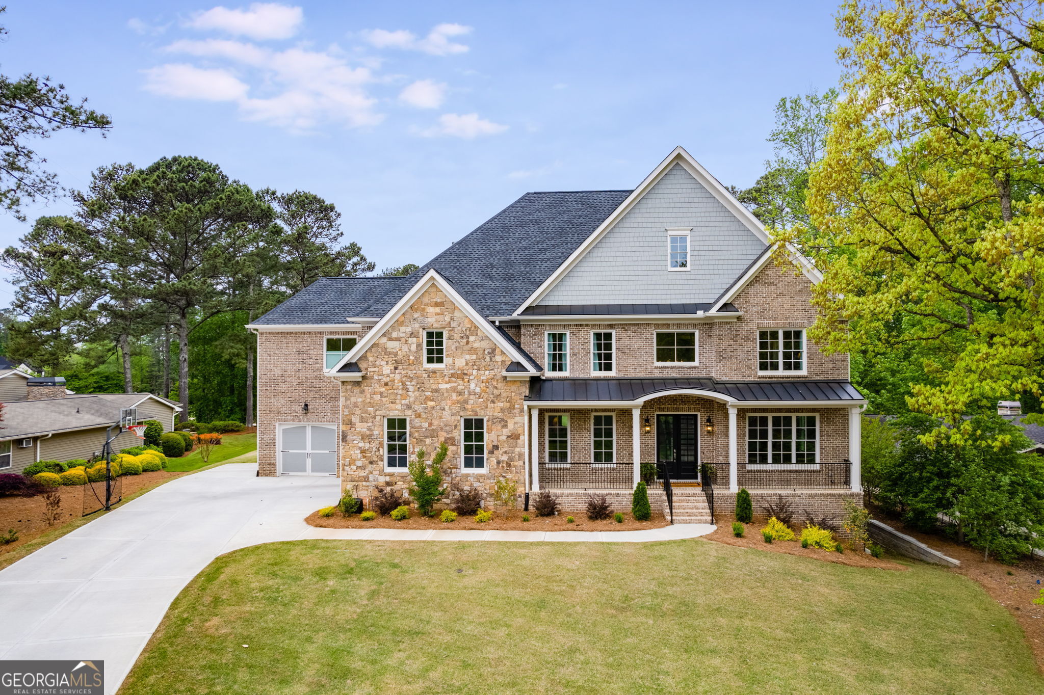 a front view of a house with a yard