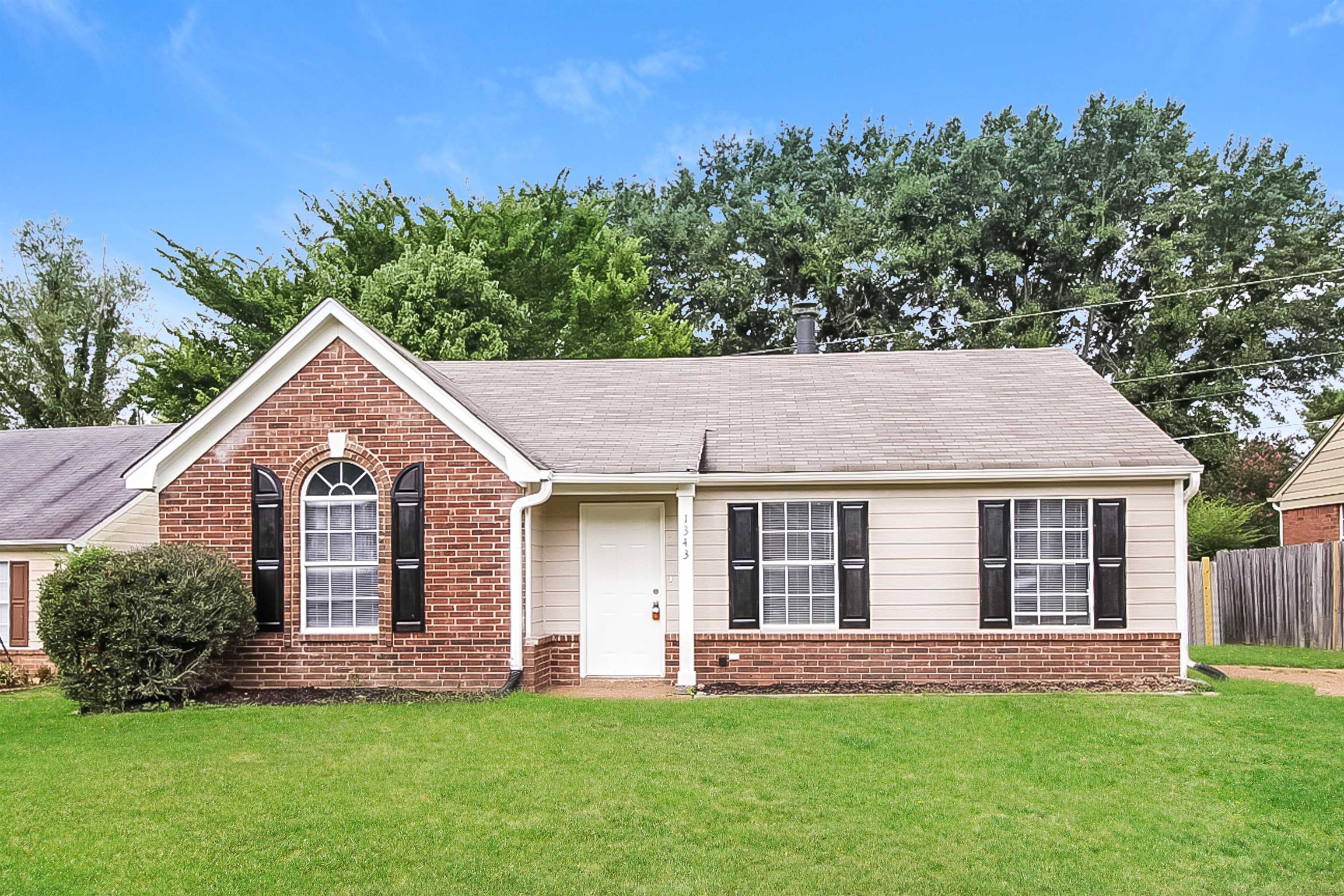 front view of a house with a yard