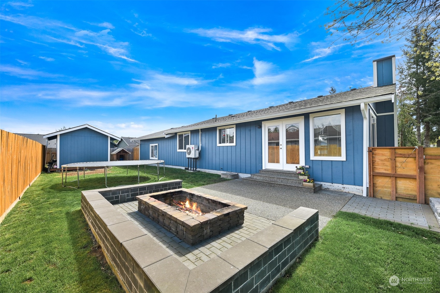 a front view of house with yard slide and outdoor seating