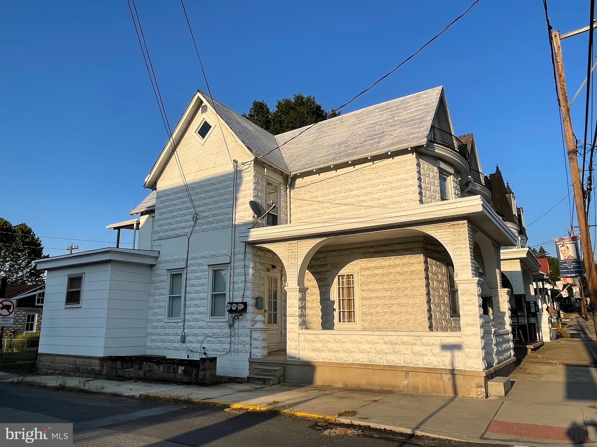 a view of a house with a street