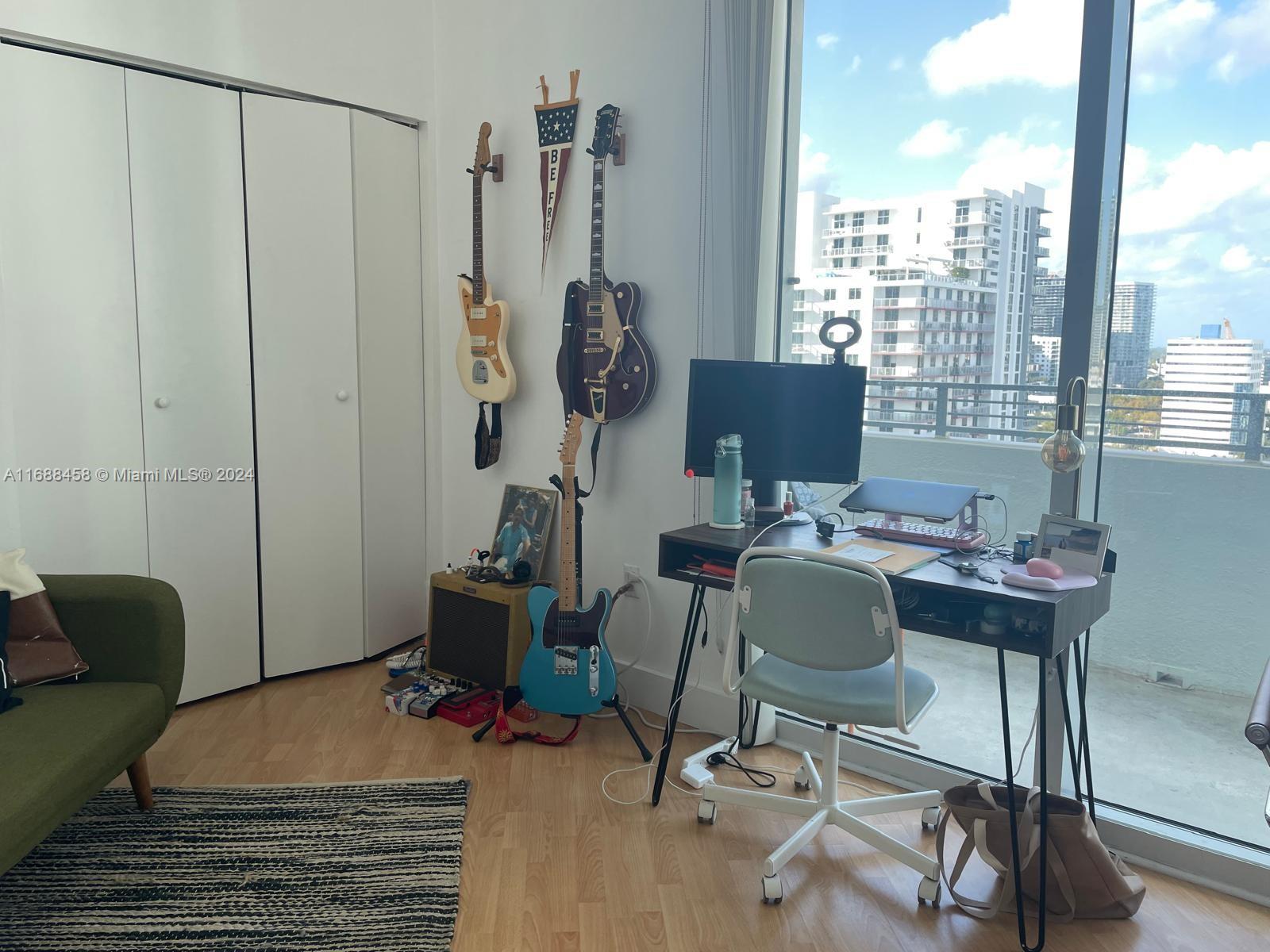 a work room with furniture and a window