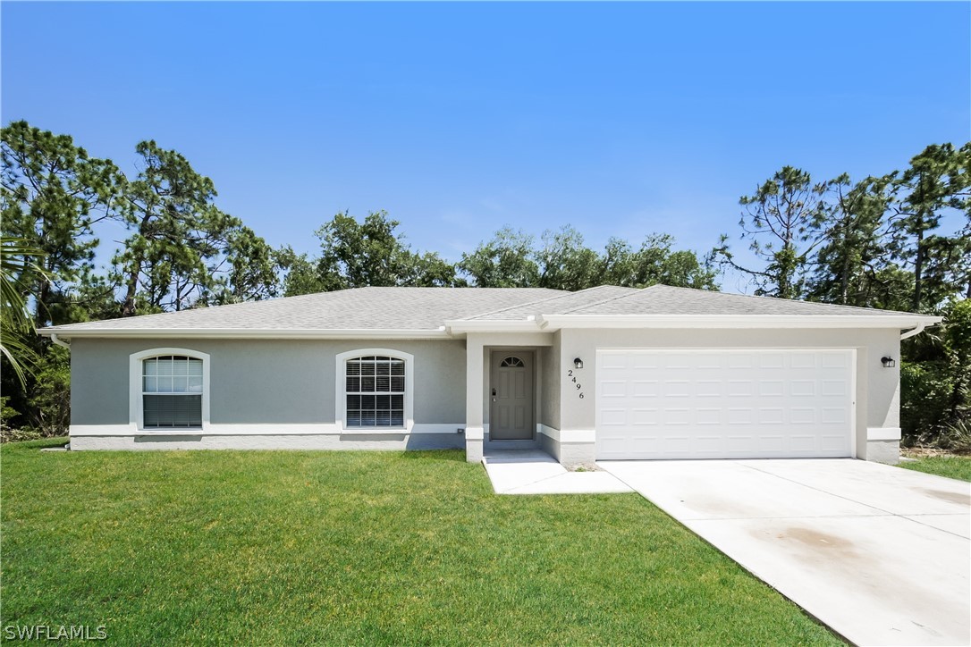 front view of a house with a yard