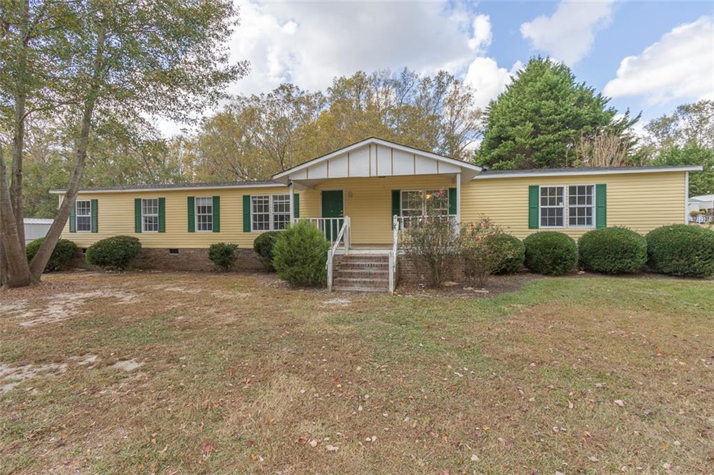 Front entrance features a covered front porch.