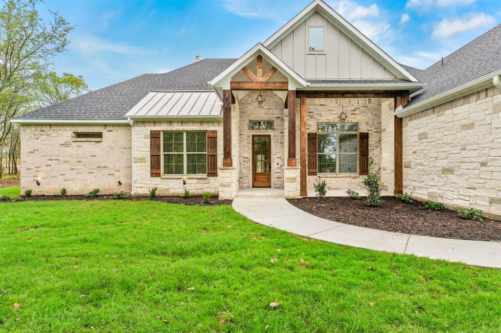 front view of a house with a yard