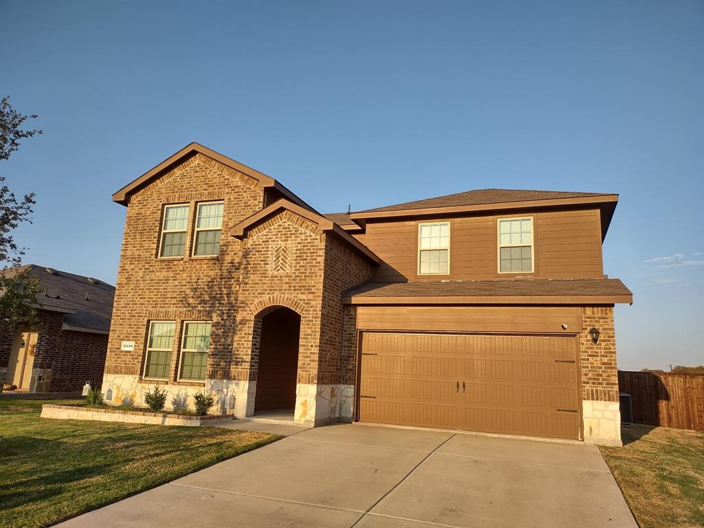 a front view of a house with a garage