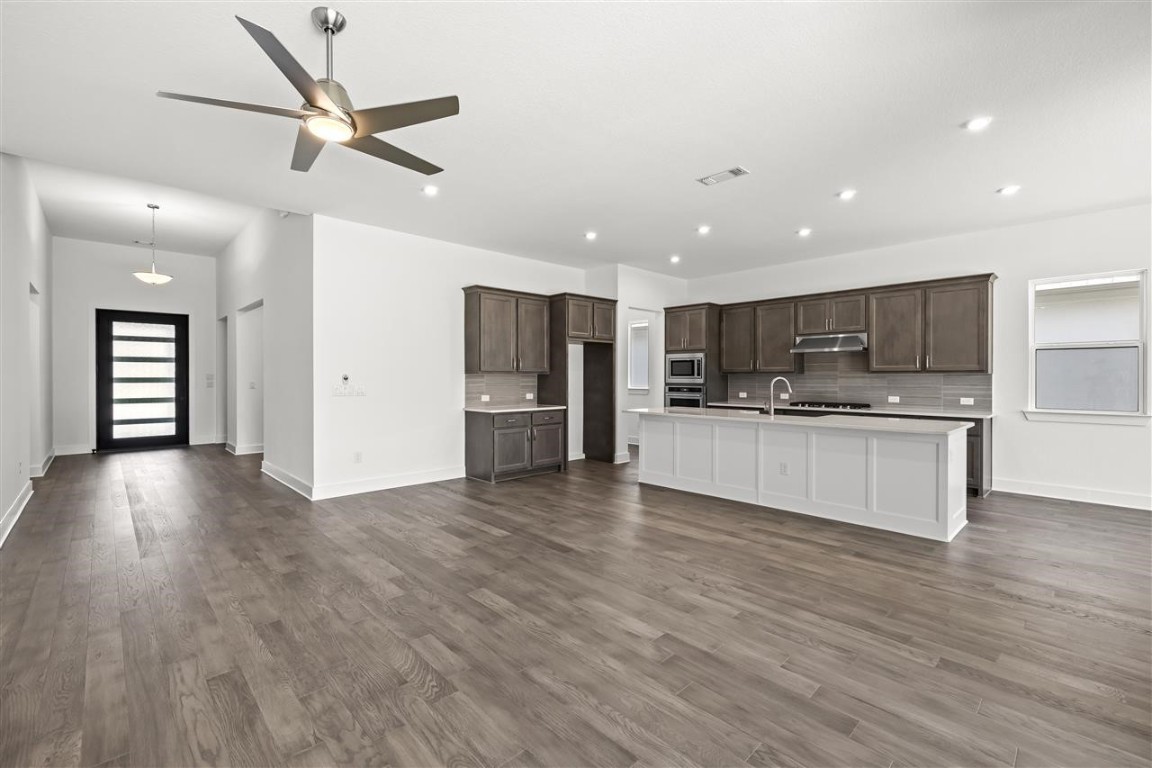 a view of kitchen with cabinets and stainless steel appliances