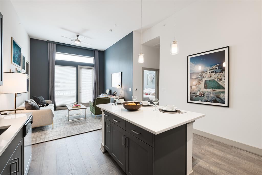 a room with a sink and a stove top oven