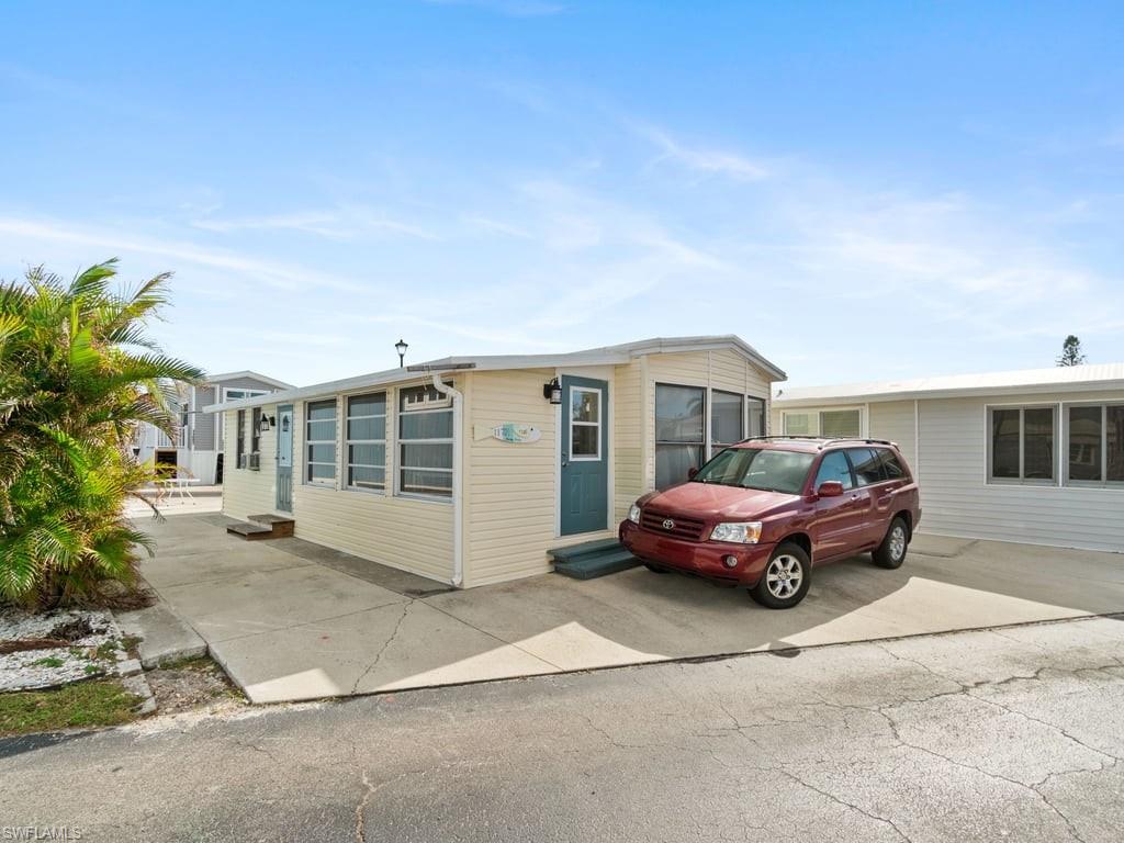 a front view of a house with parking space