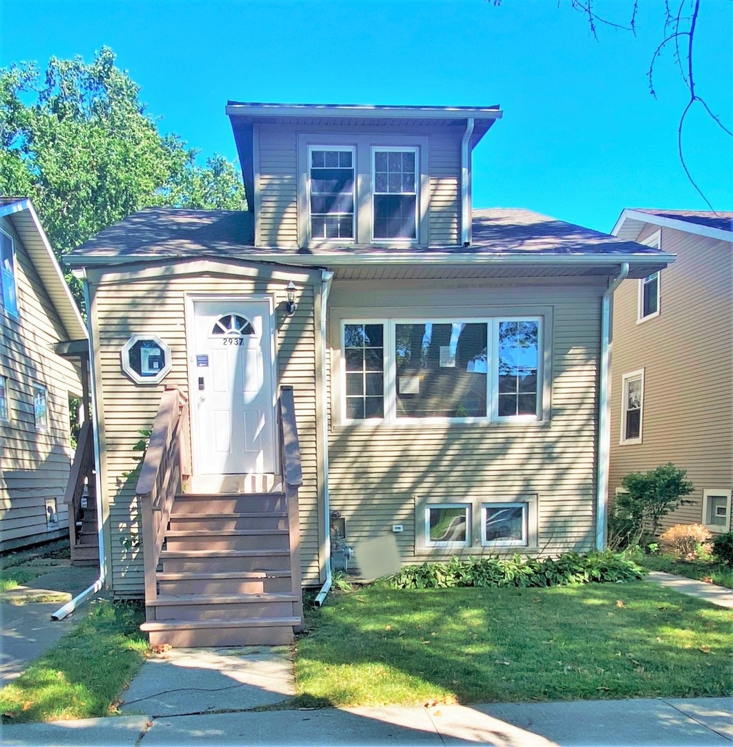 a front view of house with yard