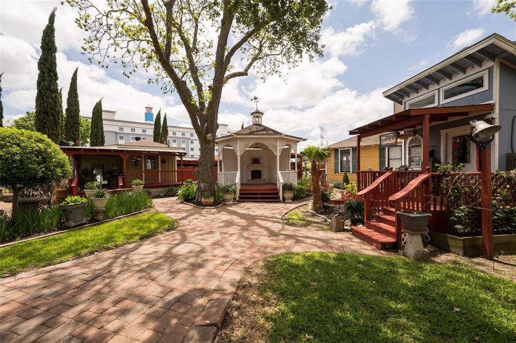 a front view of a house with yard porch and furniture