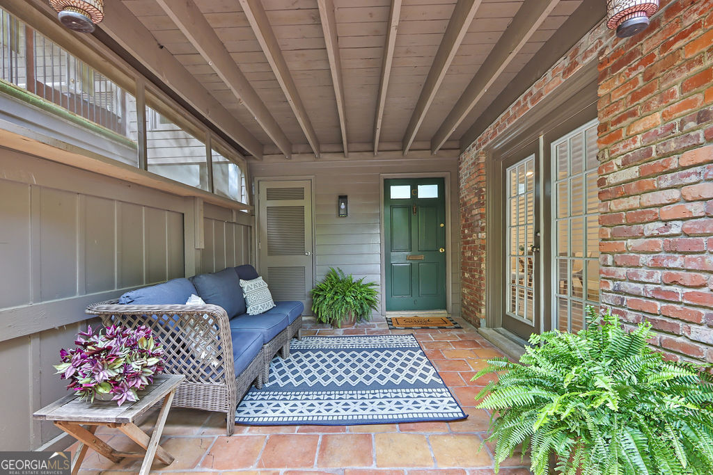 a view of balcony with furniture