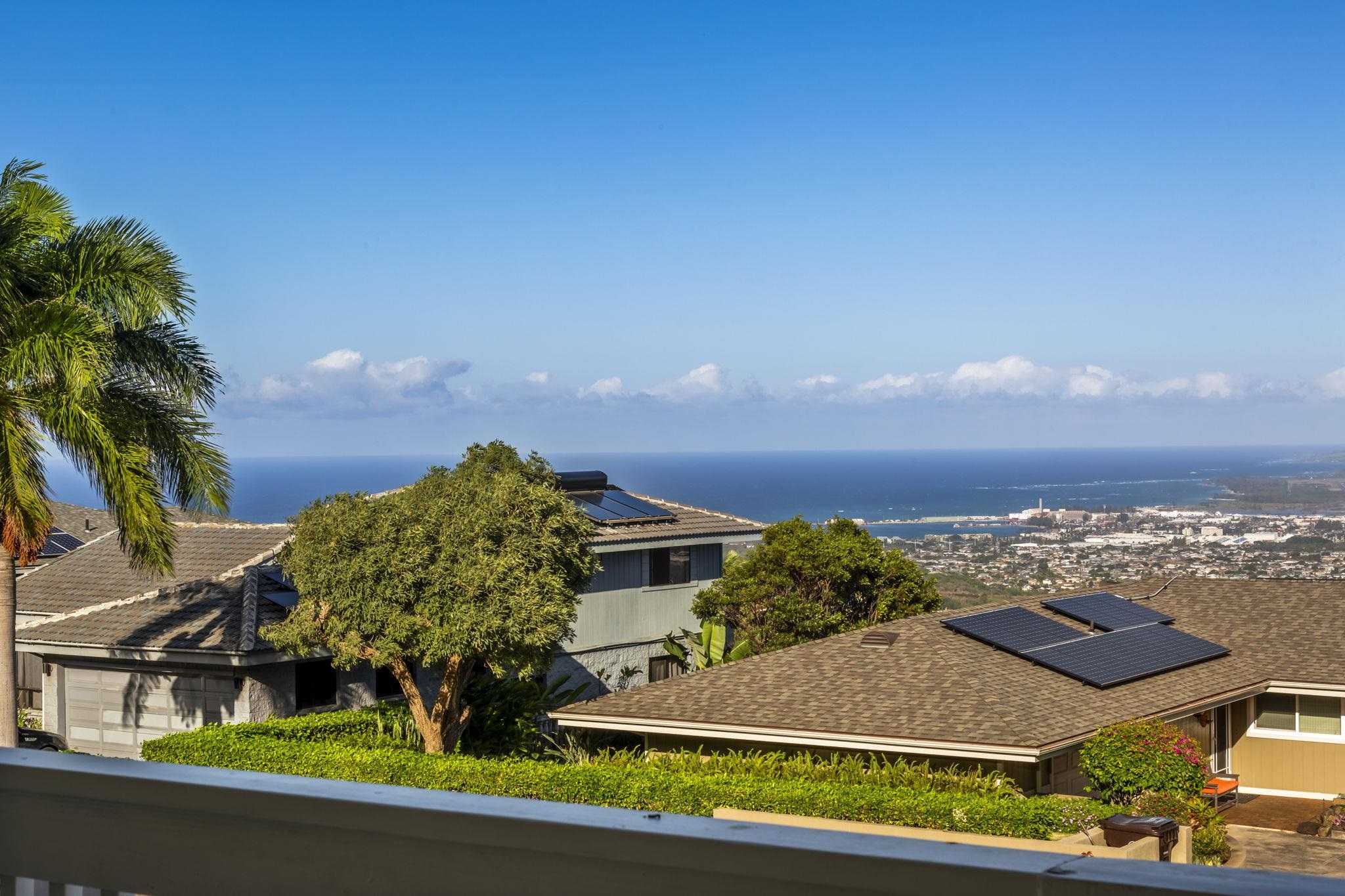 an aerial view of residential houses with outdoor space and street view