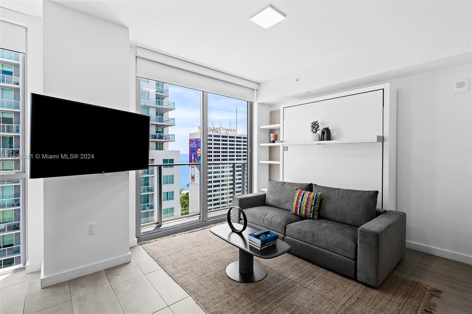 a living room with furniture and a flat screen tv