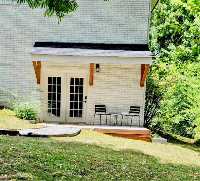 a view of a house with a yard and sitting area