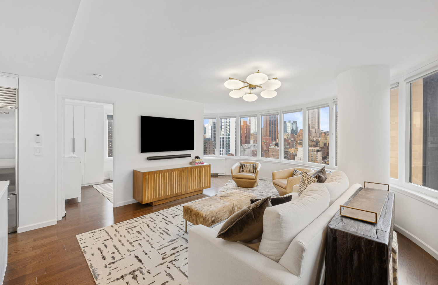 a living room with furniture and a flat screen tv