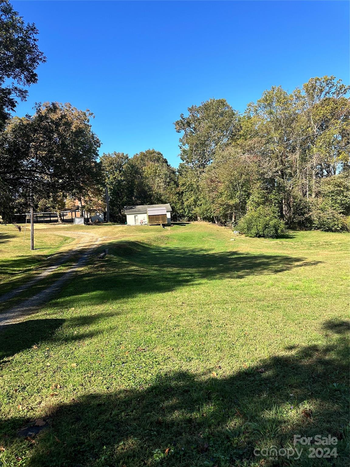 a view of a water fountain and a big yard