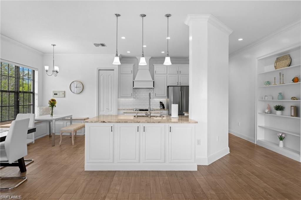 a large white kitchen with lots of counter space