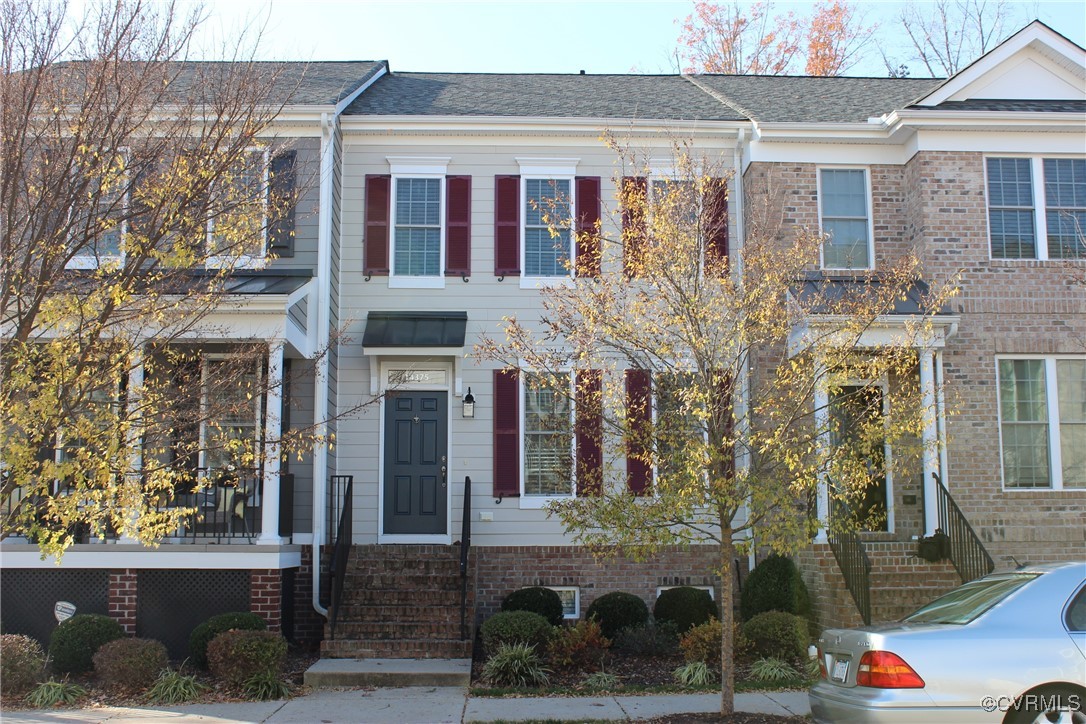 a front view of a building with glass windows and door