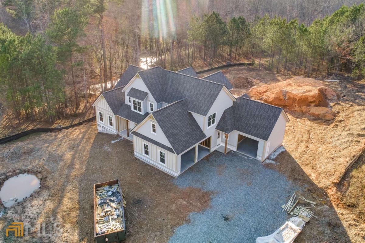 a aerial view of a house with a yard