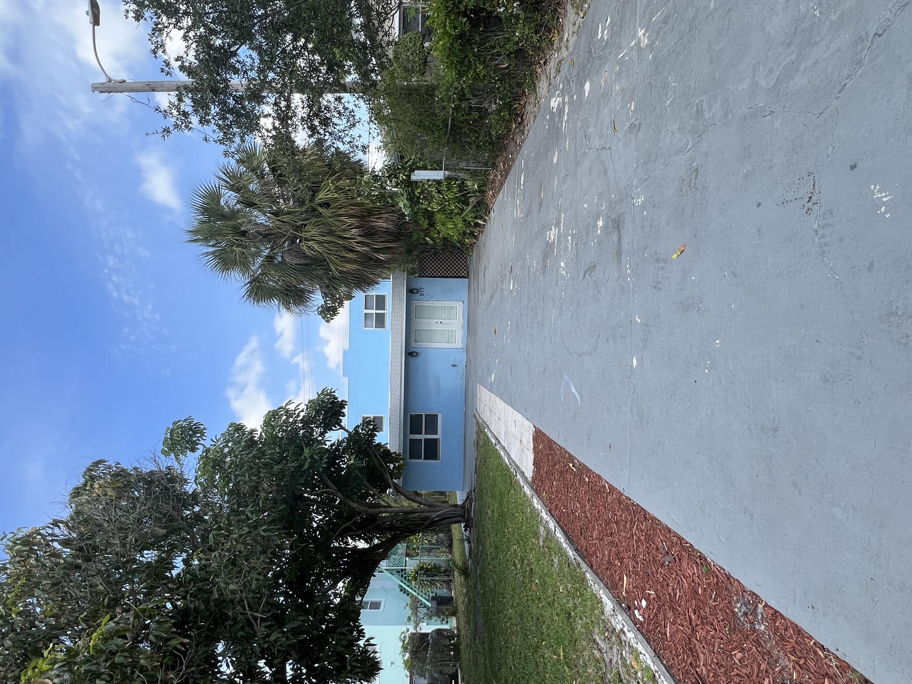 a view of a house with a yard and garage