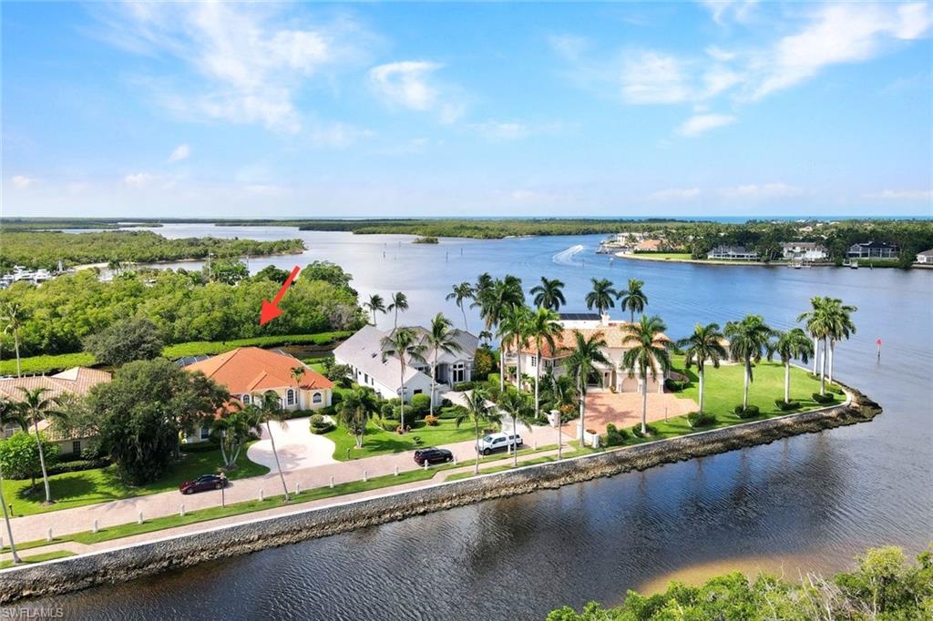 Aerial view with a water view and proximity to Naples Bay.