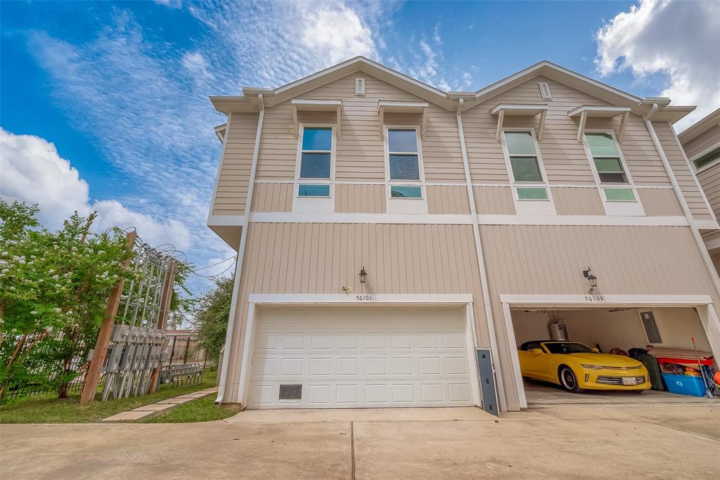 a view of a car parked in front of house