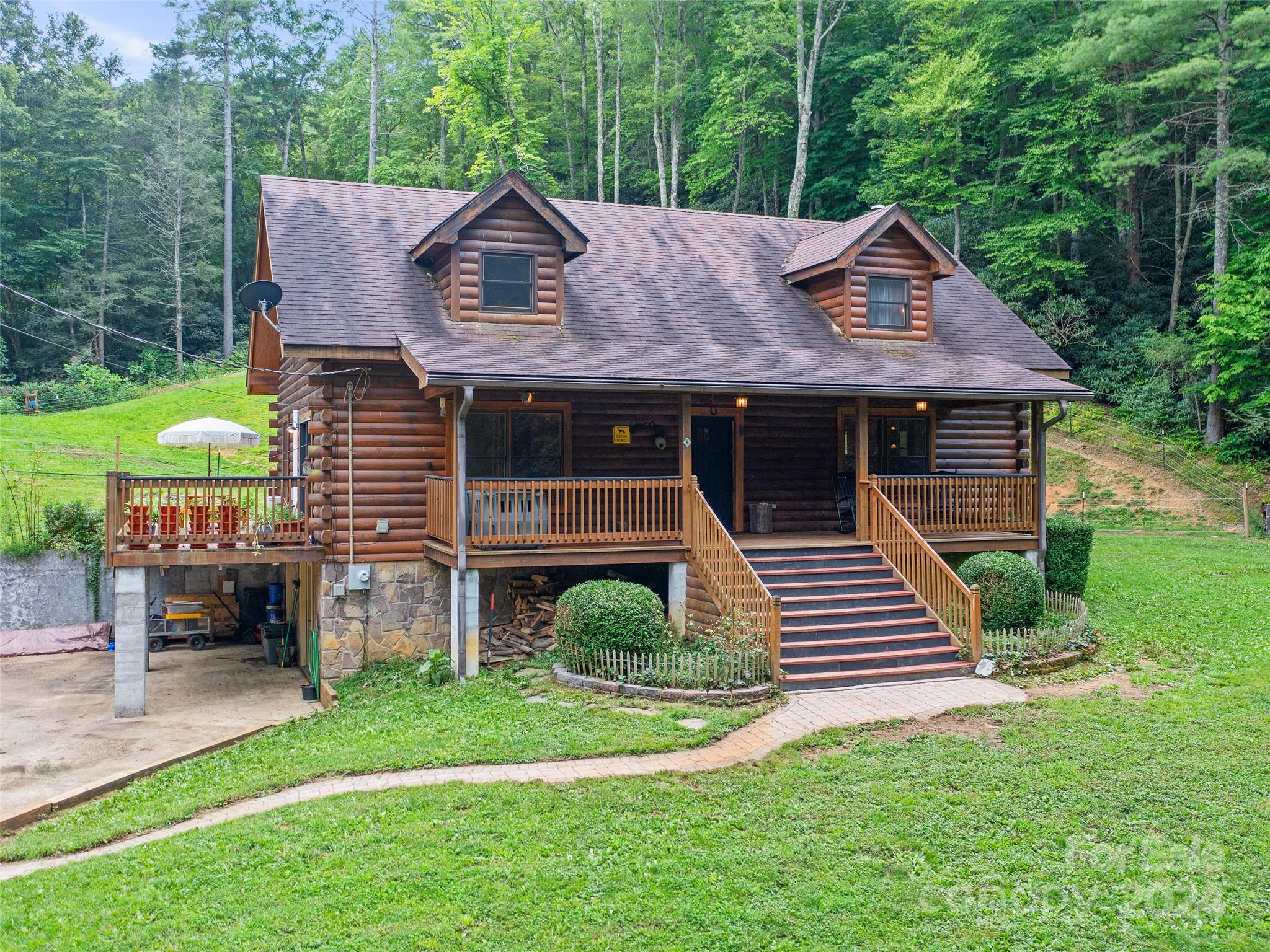 a aerial view of a house next to a yard