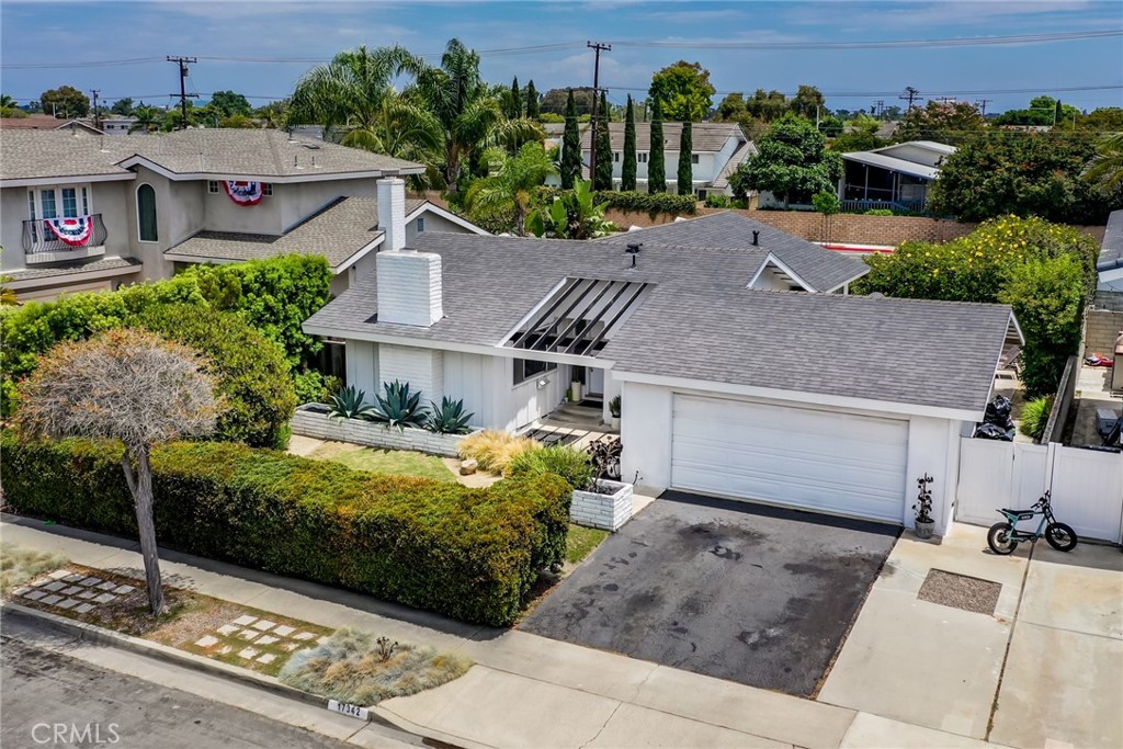 a aerial view of a house with a garden and plants