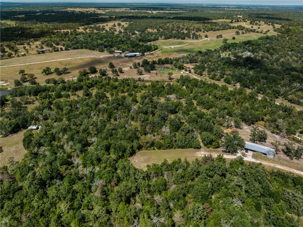 an aerial view of a houses with a yard