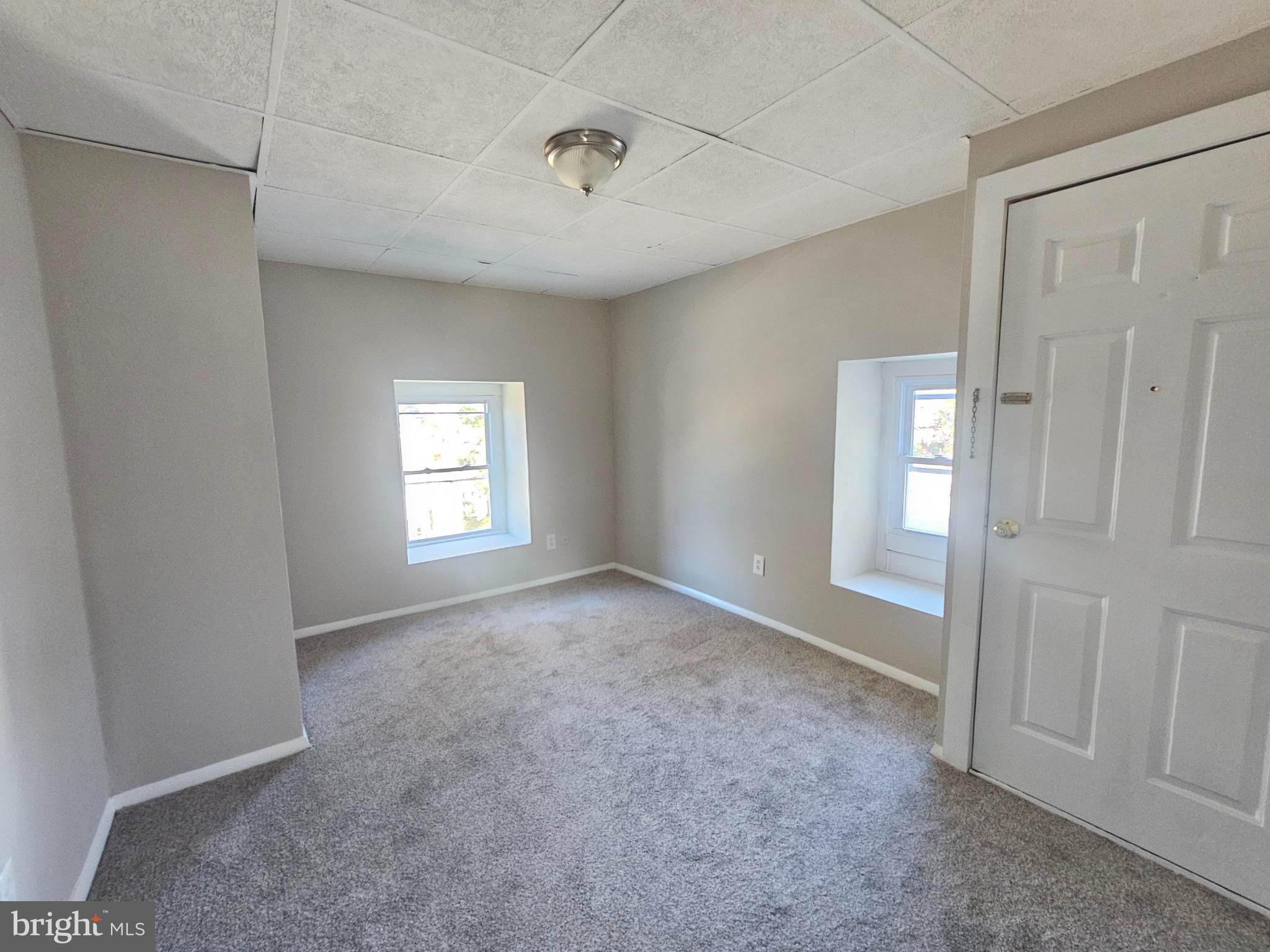 a view of empty room with windows