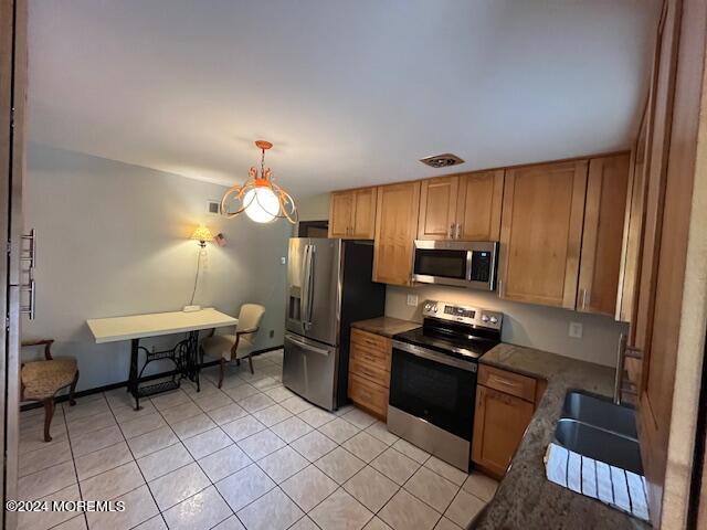 a kitchen with cabinets a sink and appliances