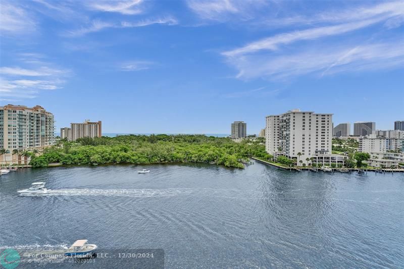 a view of a lake with tall buildings