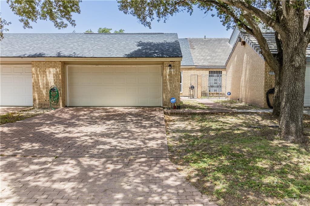 a view of a house with a tree