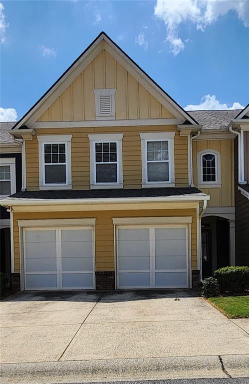 a front view of a house with a garage