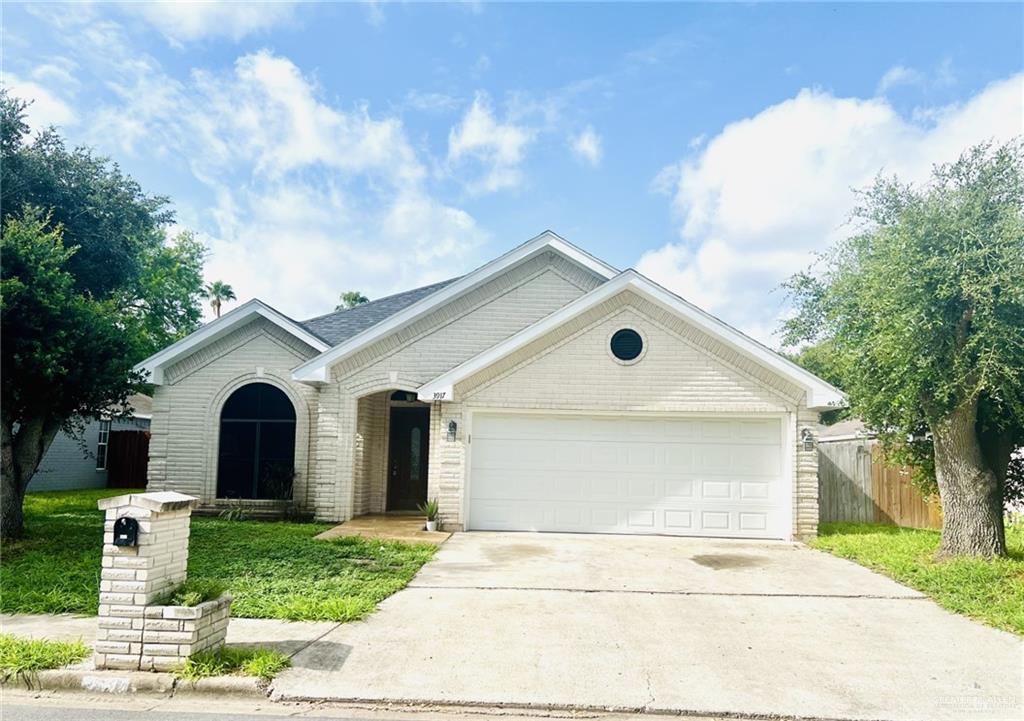 Ranch-style home featuring a garage