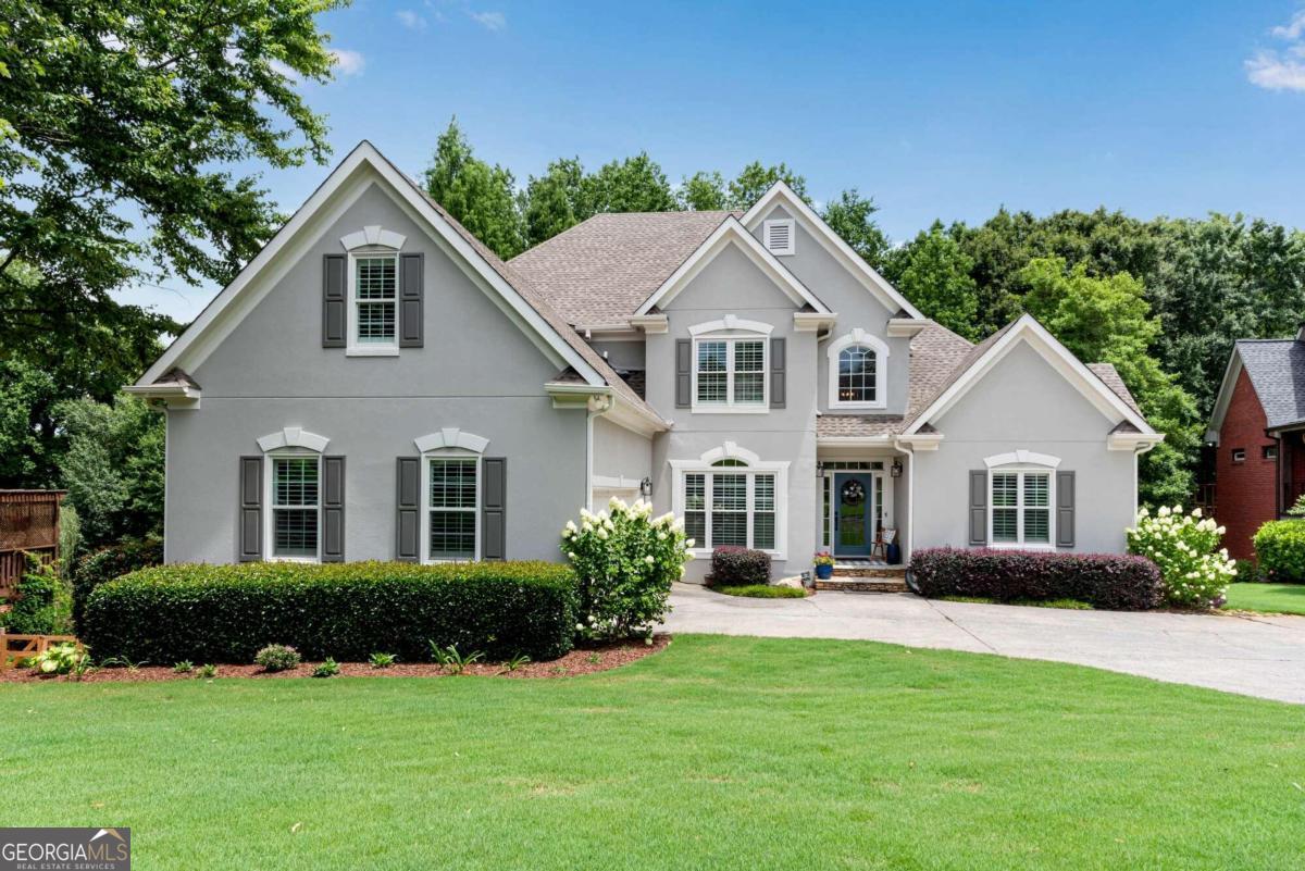 a front view of a house with a yard