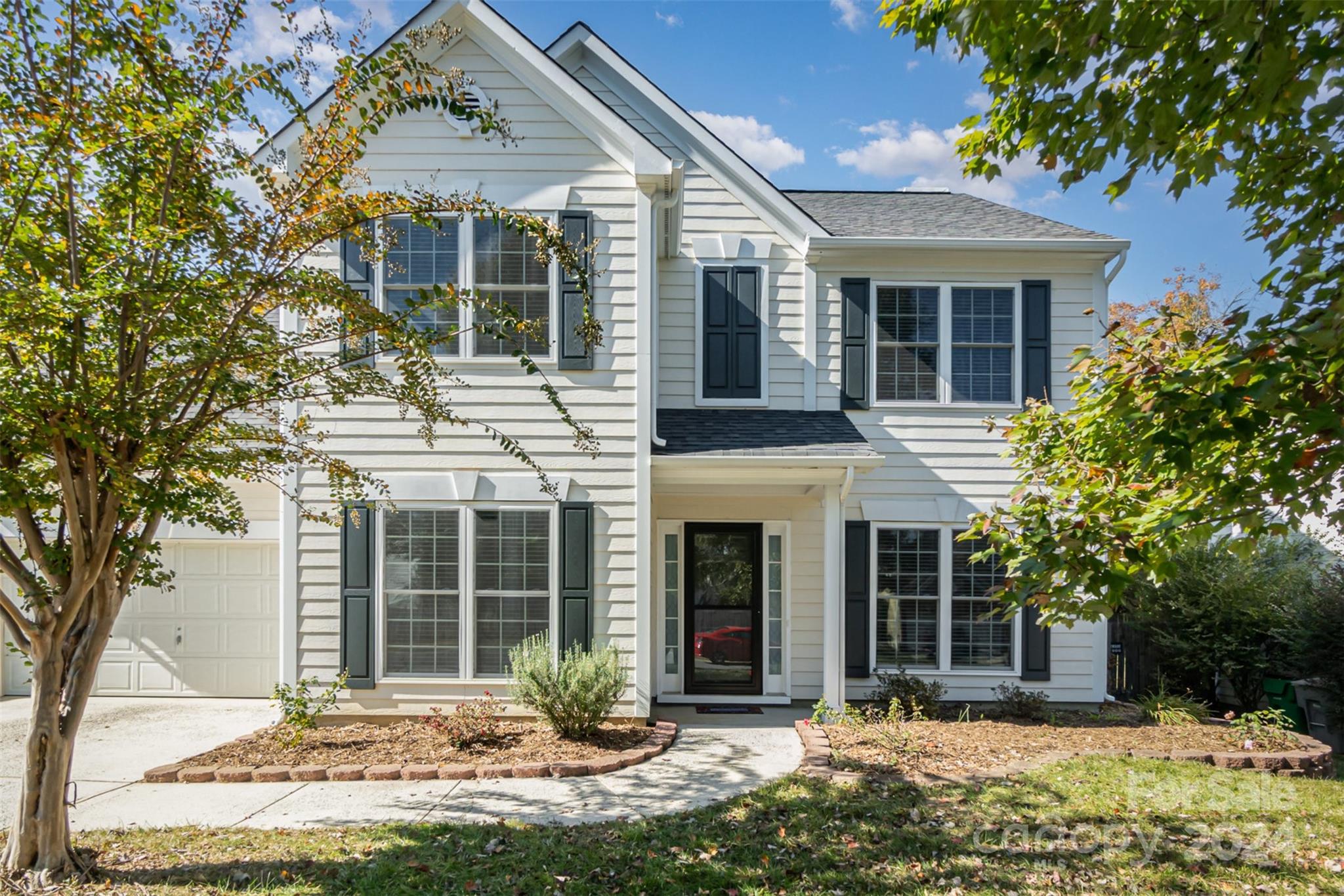 front view of a house with a yard