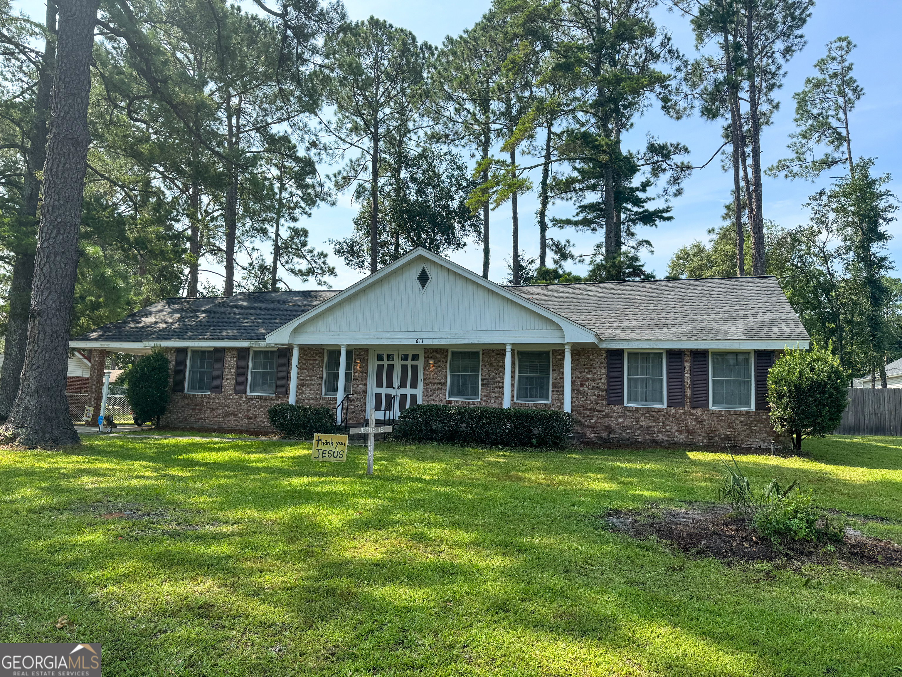 front view of a house with a yard