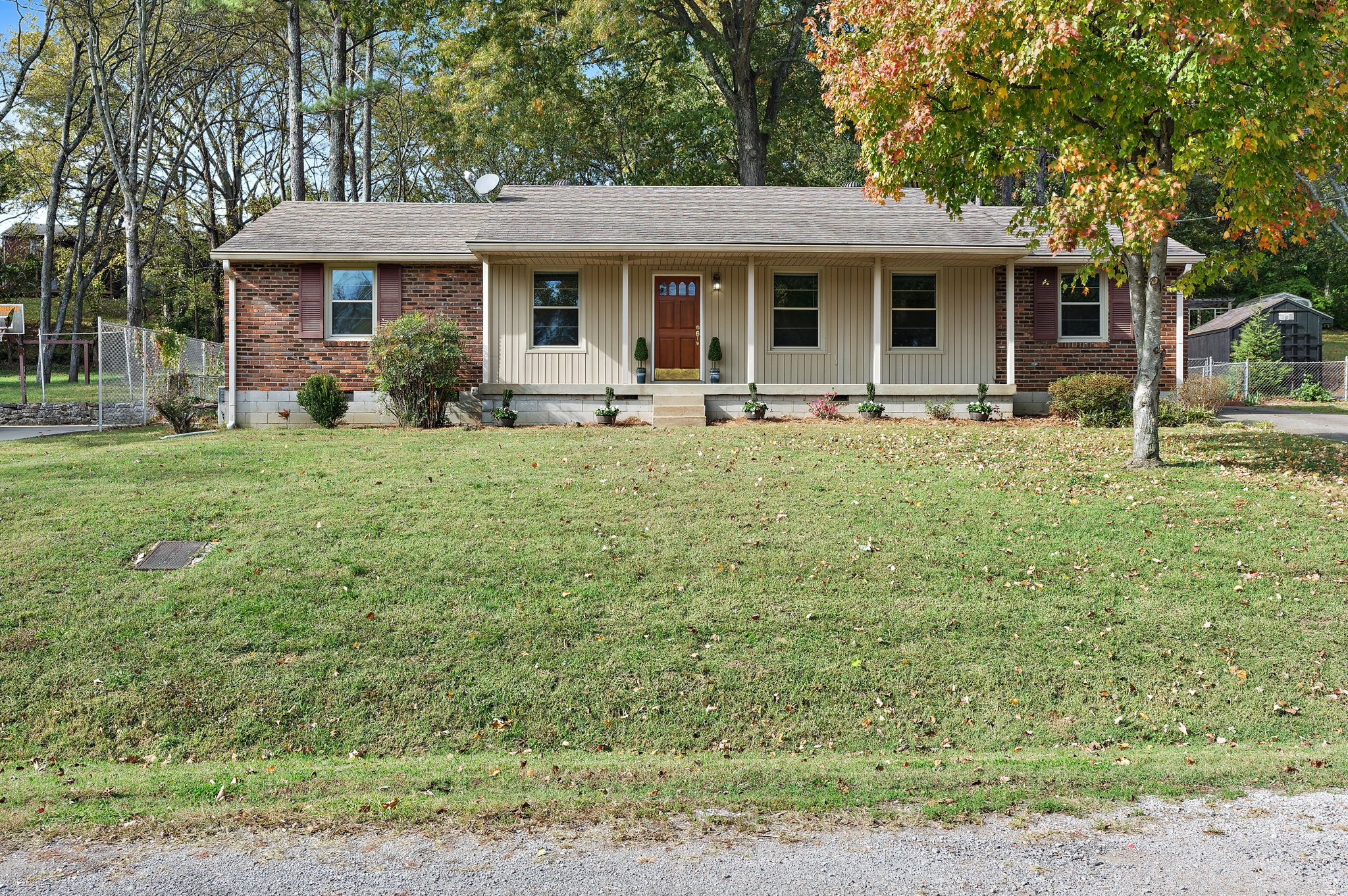 a front view of a house with garden