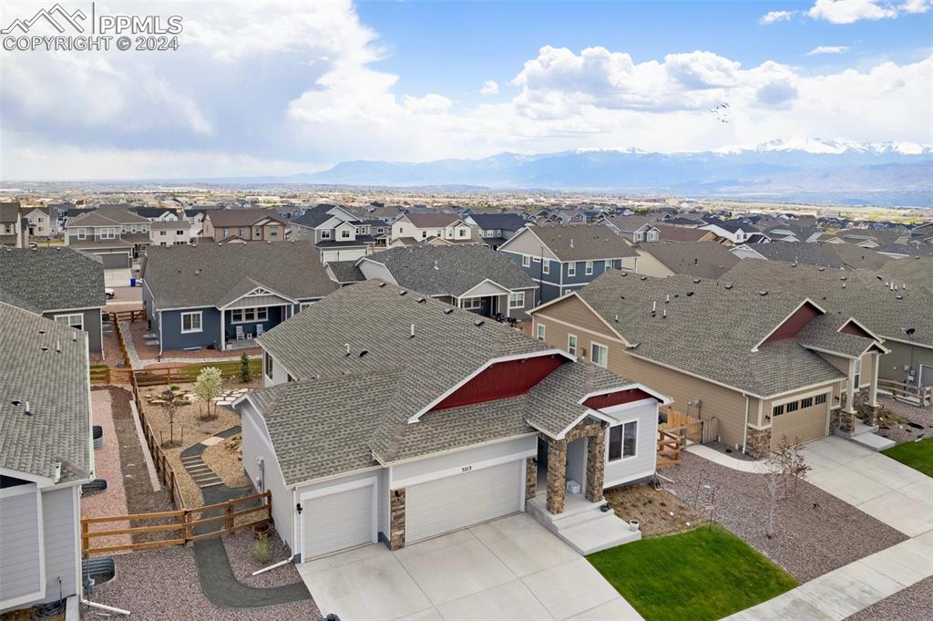 an aerial view of a house with a garden