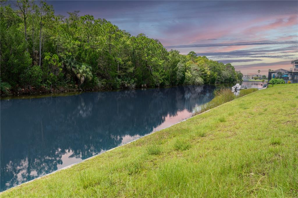 a view of a lake with a yard