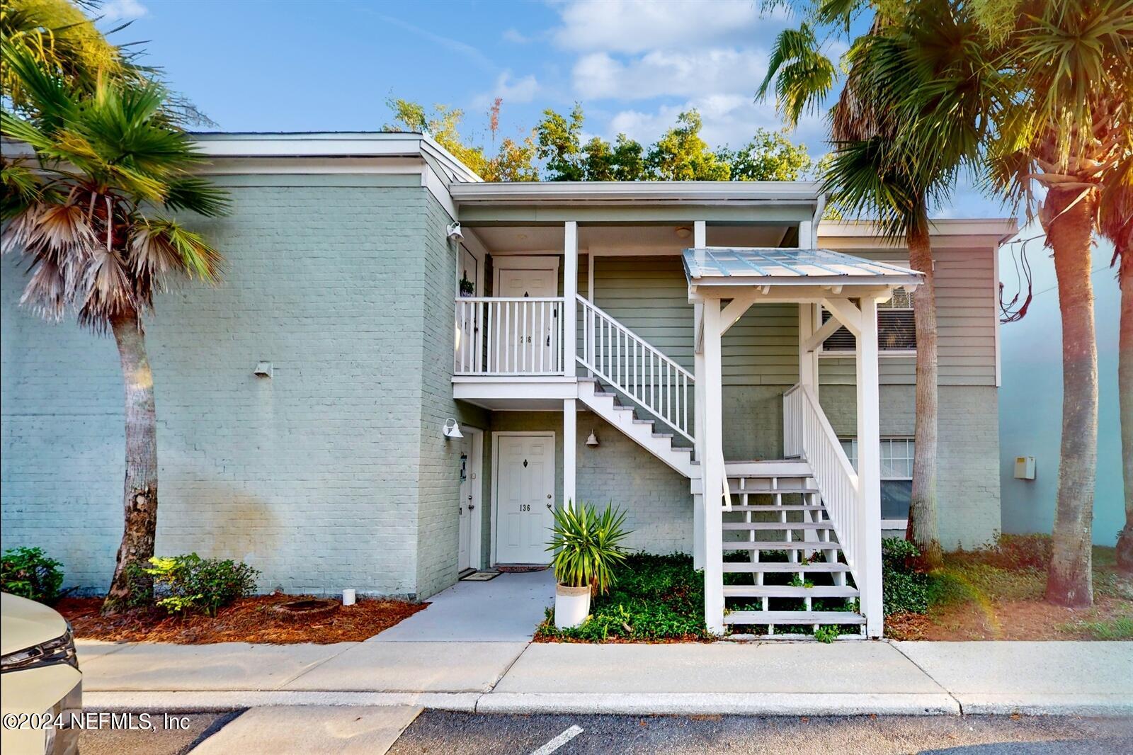 front view of a house with a potted plant