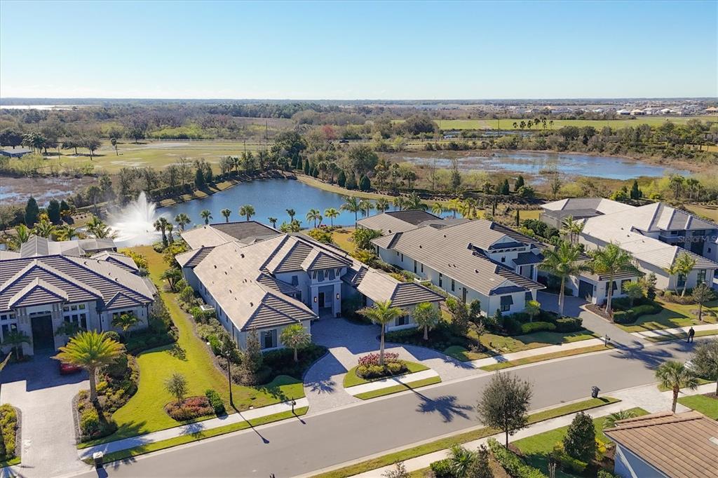 an aerial view of a house with a lake view