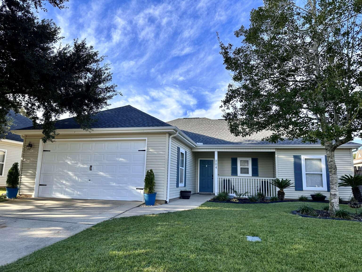 front view of a house with a yard