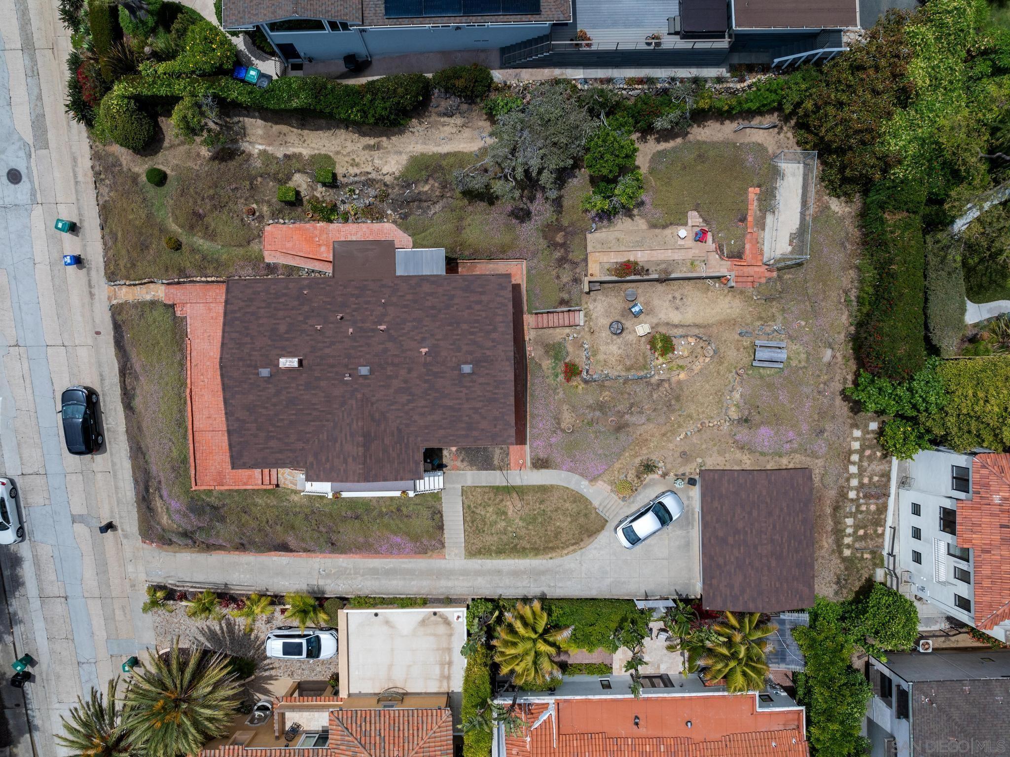 an aerial view of a house with a garden