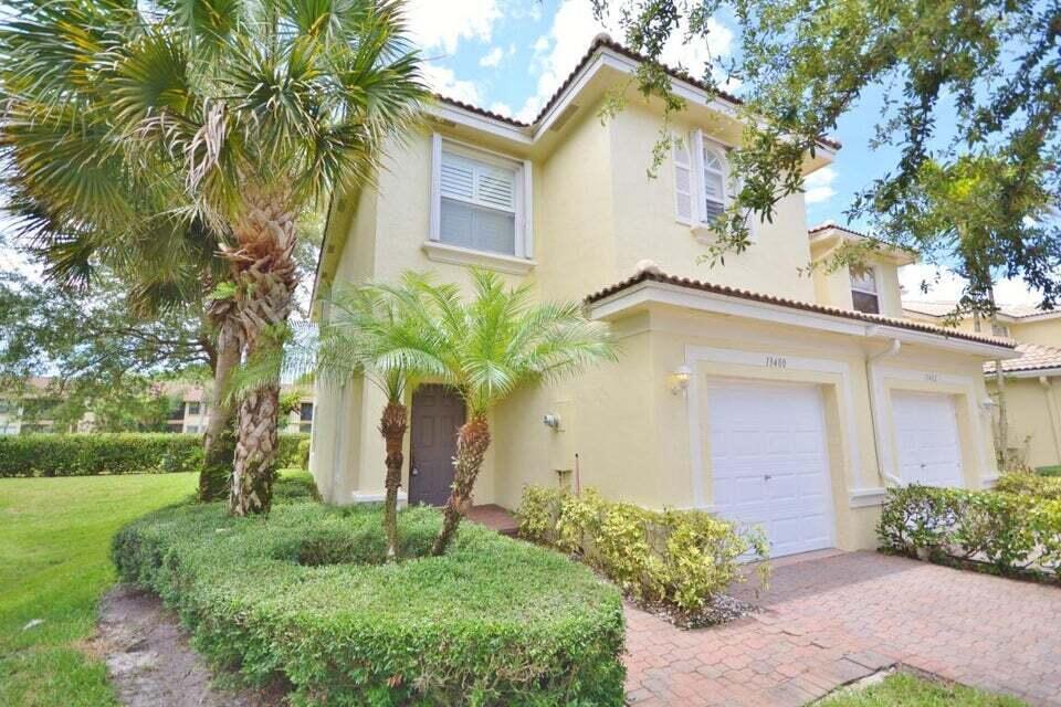 front view of a house with a yard