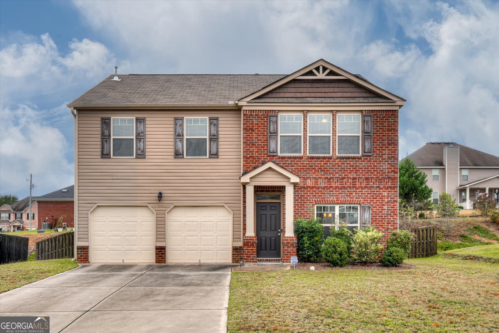 a front view of a house with a yard