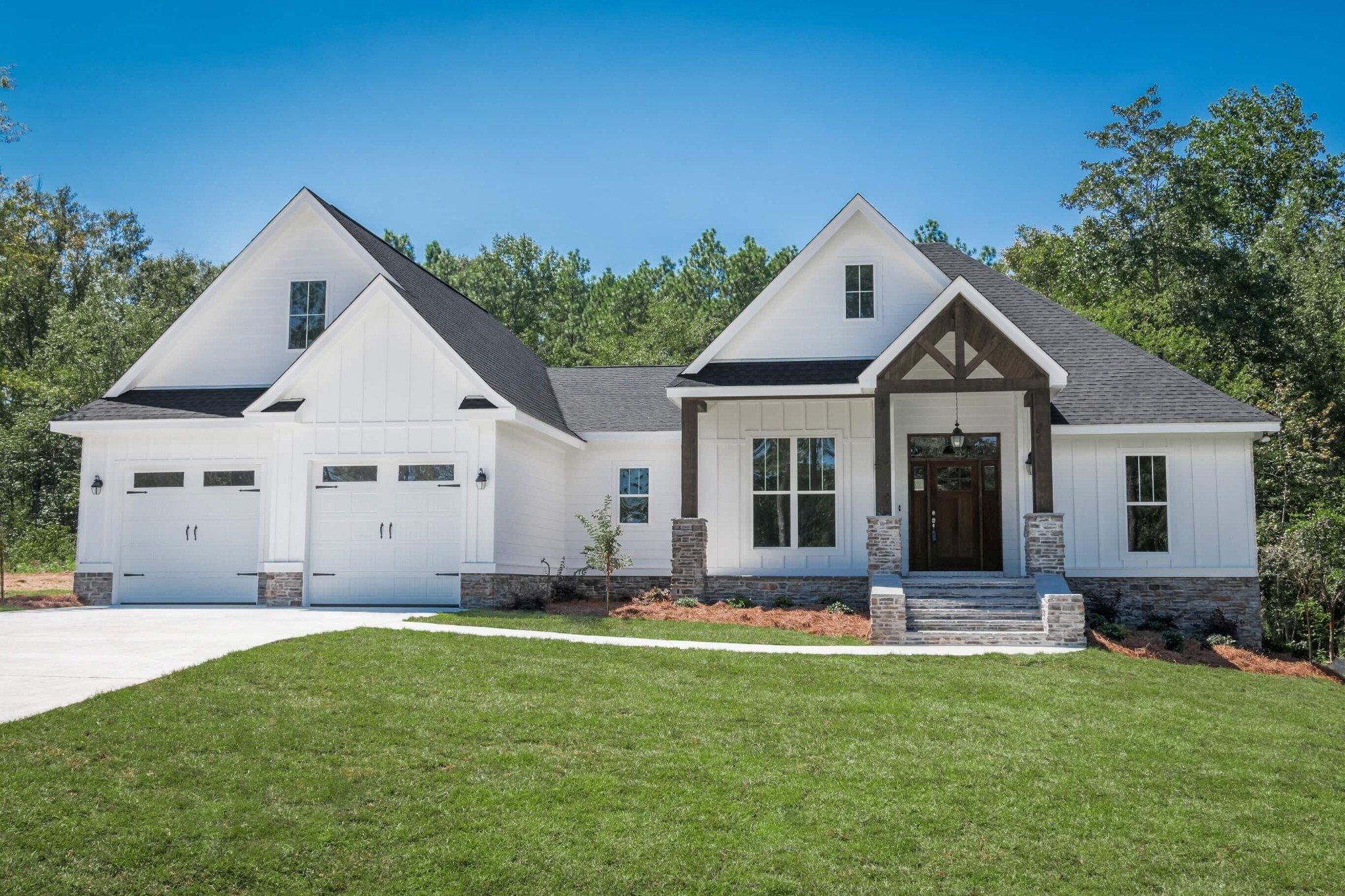 a front view of house with yard and green space