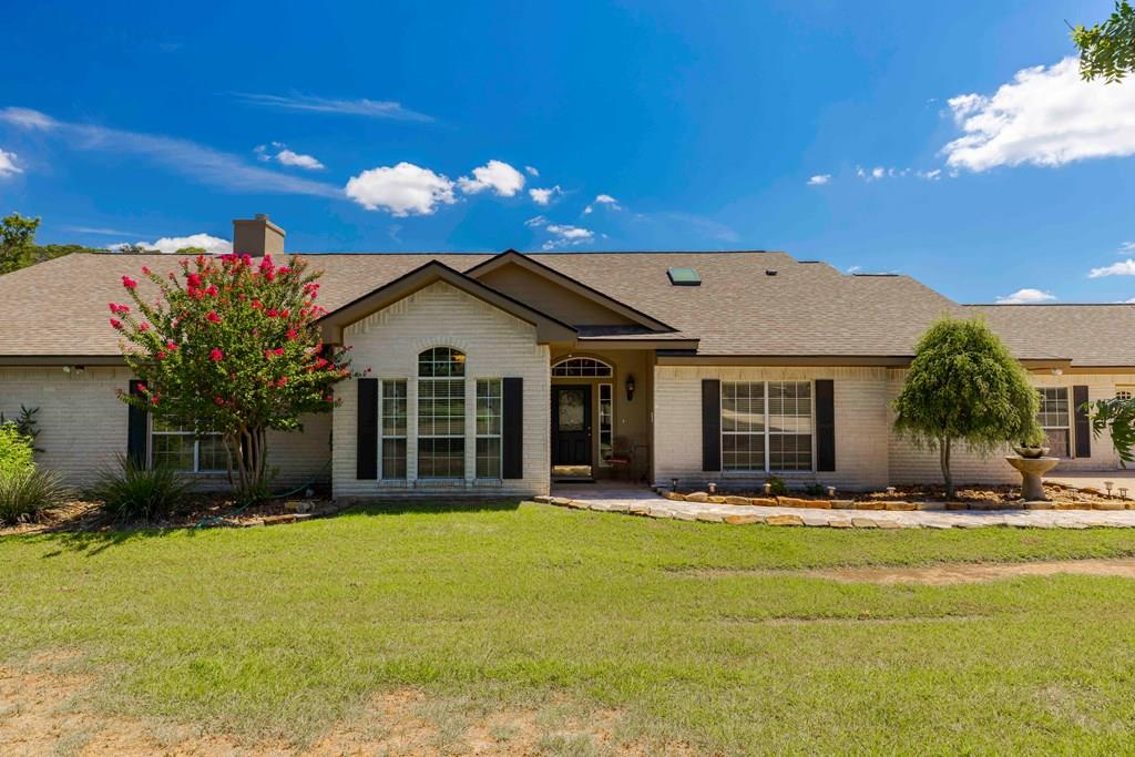 a front view of a house with a yard